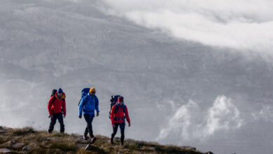 Bright outdoor hiking adventure with backpacks in rugged landscape, ideal for outdoor enthusiasts and nature lovers.