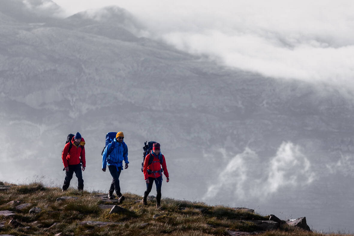 Bright outdoor hiking adventure with backpacks in rugged landscape, ideal for outdoor enthusiasts and nature lovers.