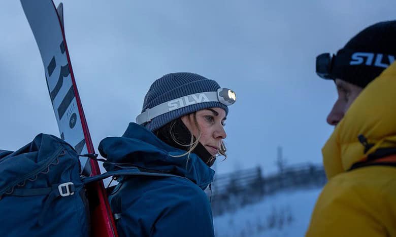 A person wearing a hat and a backpack with a snowboard AI-generated content may be incorrect.