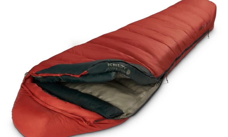 Warm red mummy sleeping bag for wild camping and outdoor adventures.