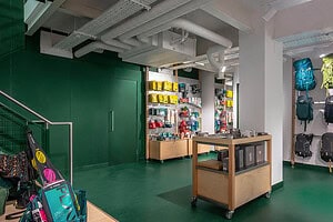 High-quality outdoor gear and camping equipment store interior with backpacks and accessories.