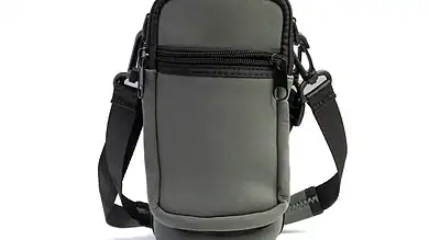 Waterproof outdoor camera bag with multiple compartments and adjustable strap for hiking and camping.