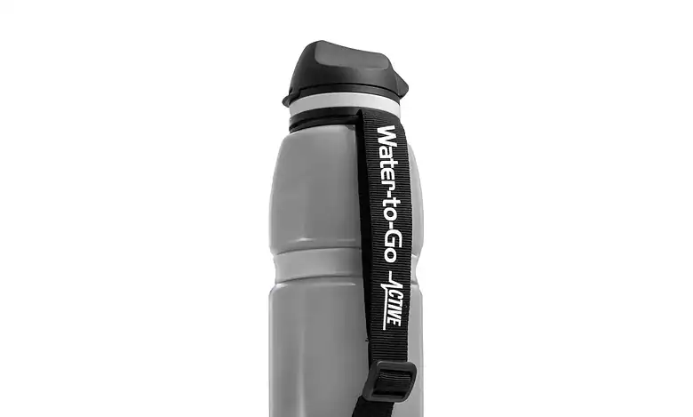 Stainless steel water bottle with strap for outdoor activities and hiking, leak-proof hydration accessory.