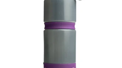 1. Reusable grey and purple water bottle with leak-proof lid for outdoor adventures.