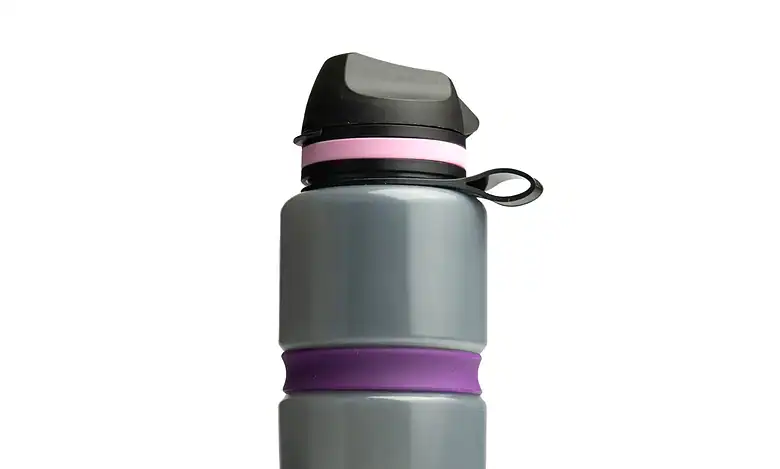 1. Reusable grey and purple water bottle with leak-proof lid for outdoor adventures.