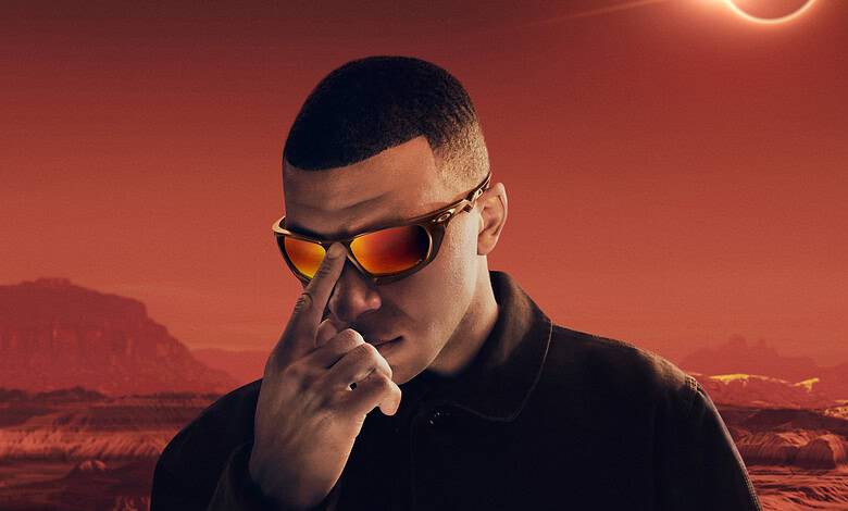 Eclipsed sun over mars landscape with man in sunglasses and black jacket, science and space exploration concept.