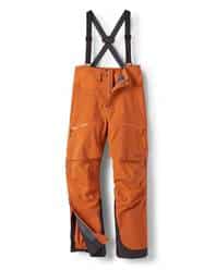 Waterproof orange outdoor trousers with suspenders for hiking and outdoor activities.