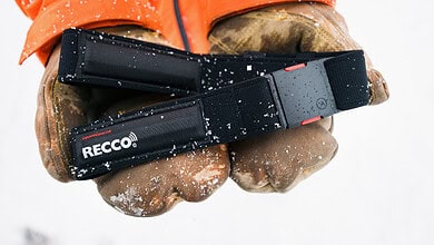 1. Durable RECCO avalanche safety beacon in snow, outdoor hiking gear.