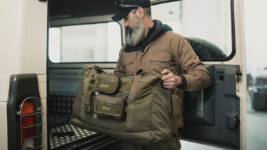 Durable outdoor gear being packed into a vehicle, showcasing hiking and travel equipment for outdoor adventures.