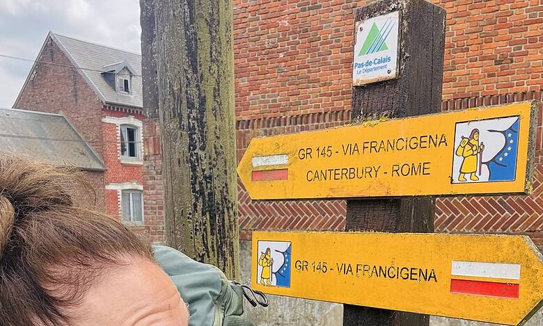 Waymarked trail sign for Camino de Santiago, France to Rome route, outdoor hiking path in UK countryside, pilgrimage trail signage, backpacker adventure photo.