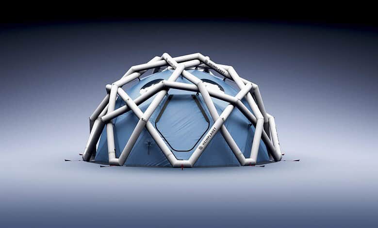 Portable outdoor event dome with inflatable frame and weather-resistant canopy for camping or festivals.