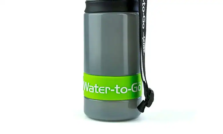 Durable grey water bottle with green "Water-to-Go" logo and strap for outdoor activities.