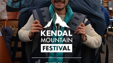 Backpacking enthusiast at Kendal Mountain Festival, showcasing outdoor adventure gear and rugged mountain landscapes.