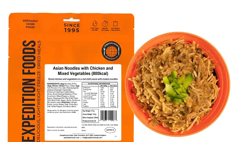 Succulent Asian noodles with chicken and vegetables in an outdoor camping meal packaging.