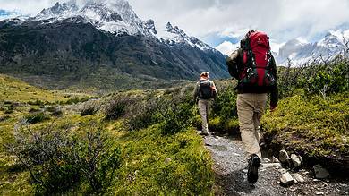 Hiking hikers with backpacks trekking in mountain landscape, alpine adventure, outdoor activity, nature exploration, outdoor insight.