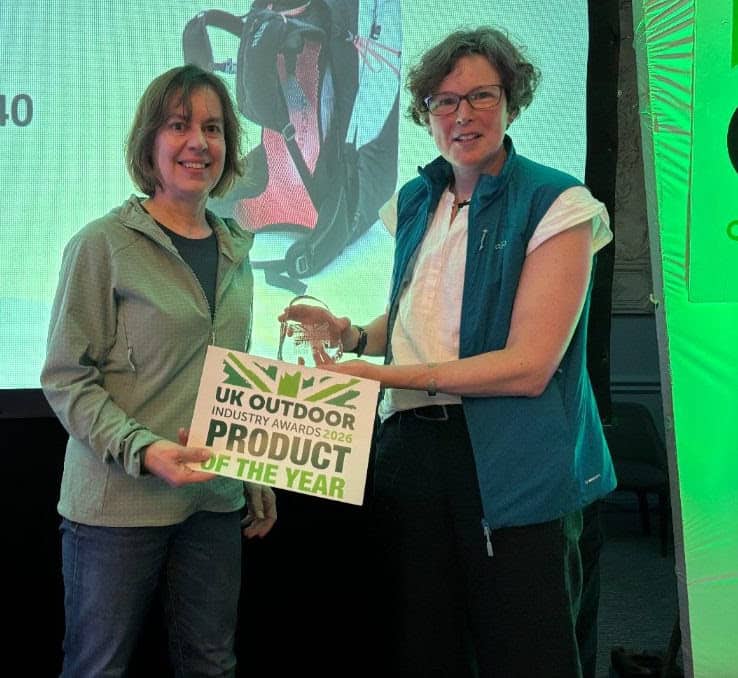 Two women holding the UK Outdoor Industry Awards 2026 Product of the Year certificate.