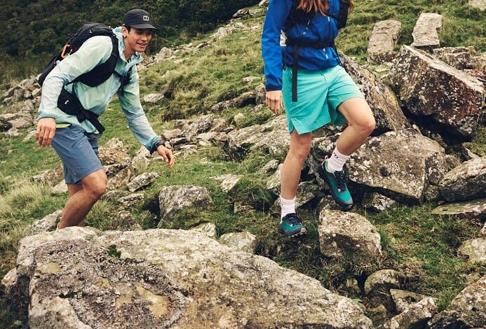 Outdoor hikers exploring rugged mountain terrain.
