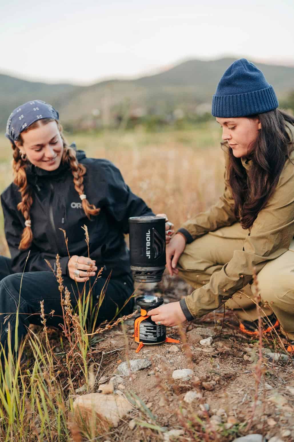 Outdoor Insight portable camping stove and cookware in outdoor setting.