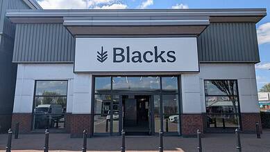 Exterior view of Blacks outdoor retail store showcasing outdoor gear and apparel.