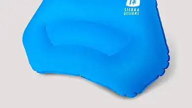 Inflatable blue pool float with Sierra Designs logo for outdoor swimming and relaxation.