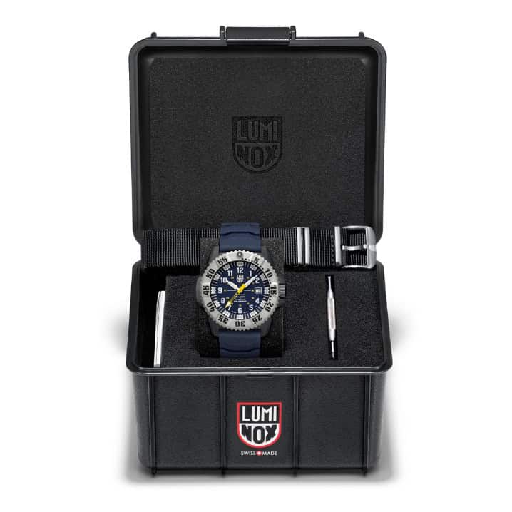Luminox watch with tool kit in protective case for outdoor adventures.