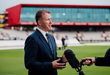 Daniel Gidney being interviewed at a sports stadium before his retirement.