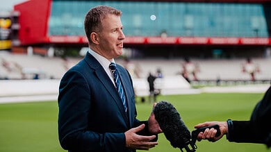 Daniel Gidney being interviewed at a sports stadium before his retirement.