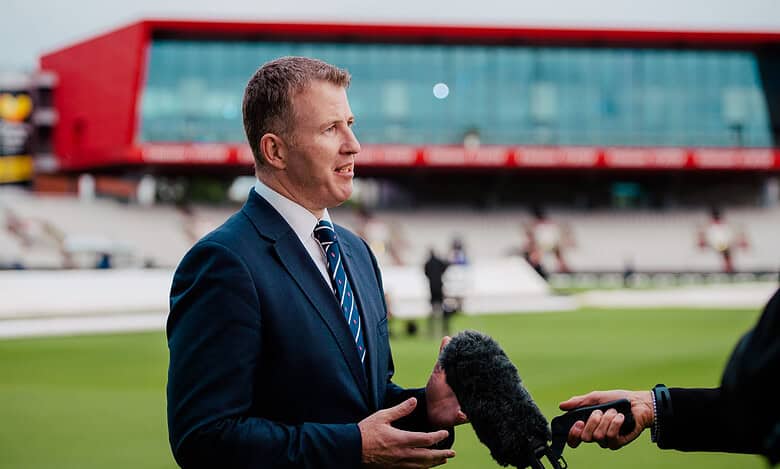 Daniel Gidney being interviewed at a sports stadium before his retirement.