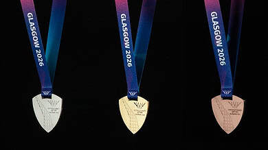 High-quality medals from Glasgow 2026 Winter Sports event with colourful ribbons and metallic finish.