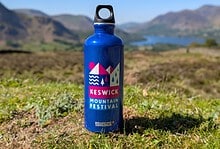 Outdoor Insight mountain festival themed water bottle for outdoor adventures.