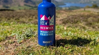 Outdoor Insight mountain festival themed water bottle for outdoor adventures.