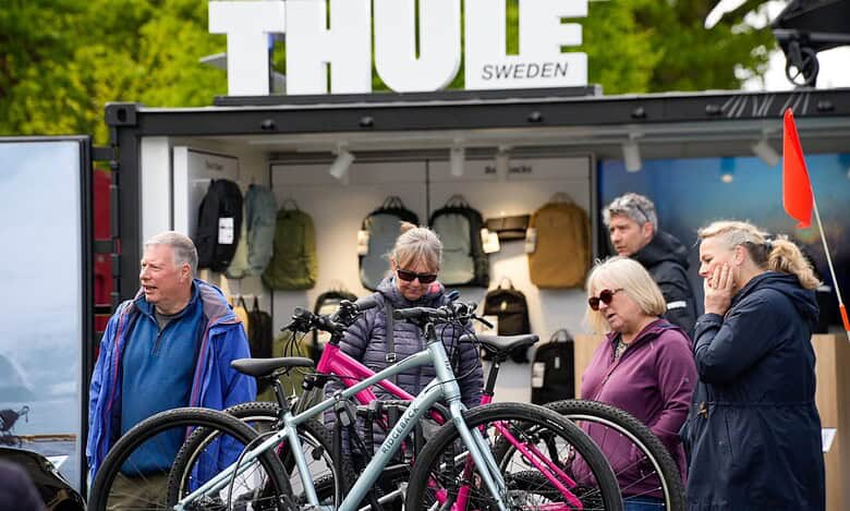 Durable outdoor backpacks and cycling gear displayed at Thule Sweden booth.