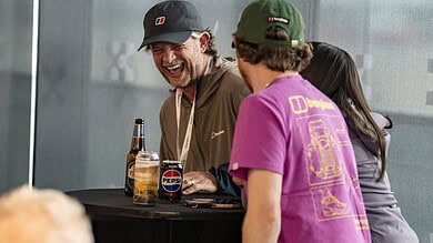 A comfortable social gathering with friends enjoying drinks indoors.