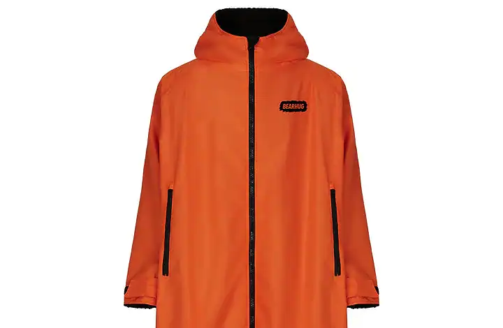 Bright orange waterproof outdoor coat with black accents and hood, ideal for hiking and outdoor adve.