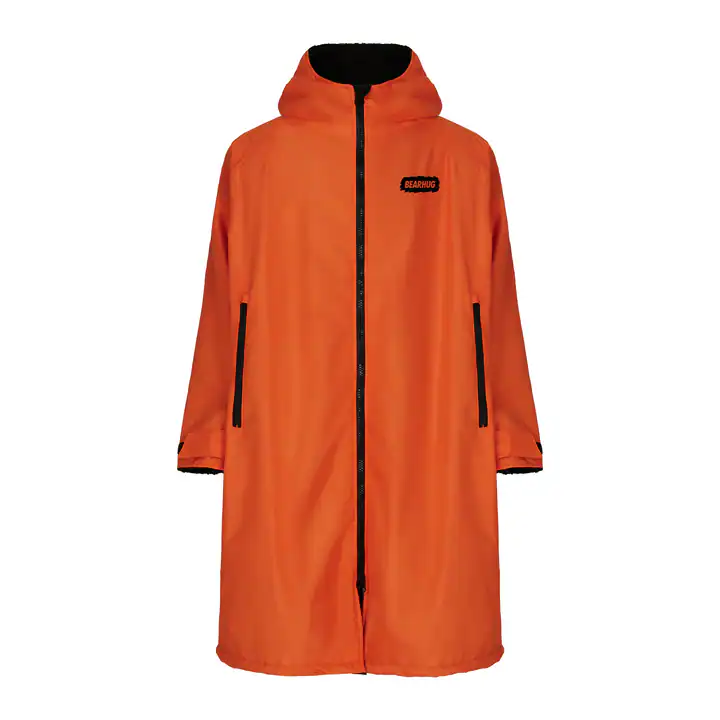 Bright orange waterproof outdoor coat with black accents and hood, ideal for hiking and outdoor adve.