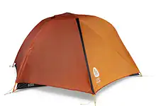 Orange lightweight camping tent for outdoor adventures and hiking trips.