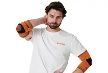 Man wearing orange elbow supports for tennis elbow recovery.