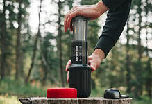 Portable air pump for outdoor camping, hiking, and adventure activities. Compact and easy to use.