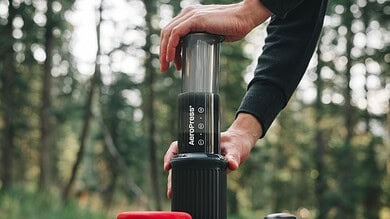 Portable air pump for outdoor camping, hiking, and adventure activities. Compact and easy to use.
