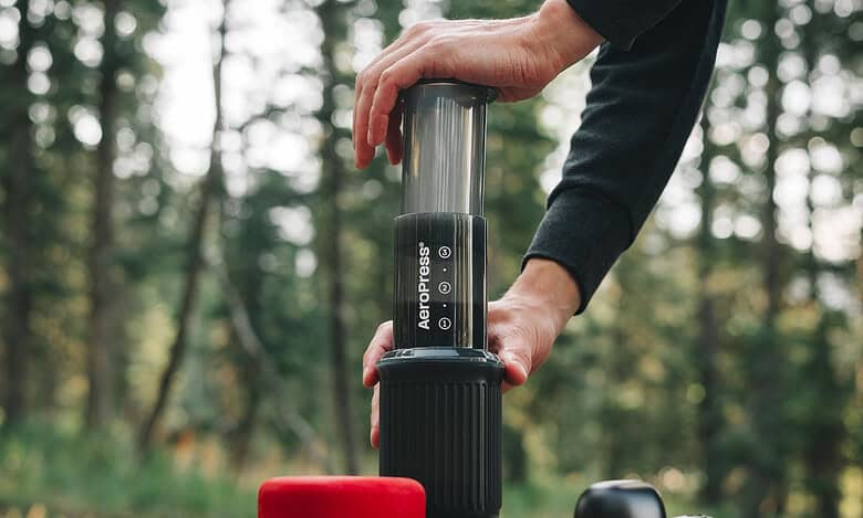 Portable air pump for outdoor camping, hiking, and adventure activities. Compact and easy to use.