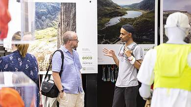 Outdoor Insight booth at an event showcasing nature photography and conservation efforts.