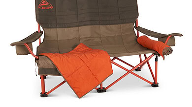 Kelly outdoor folding bench with armrests, blanket, and sleeping pad for camping.