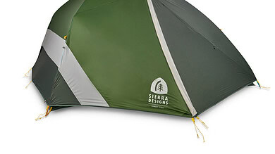Green Sierra Designs camping tent with grey and white accents for outdoor camping.